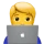 Blond person with short hair using a silver laptop with an apple logo.